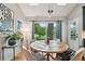 Bright dining area with a rustic table, comfortable chairs, and a picturesque outdoor view at 177 Coopers Pond Dr, Lawrenceville, GA 30044