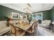 Dining room features a spacious table, stylish chairs, a light fixture, and a large window at 177 Coopers Pond Dr, Lawrenceville, GA 30044