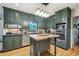 Spacious kitchen featuring a wooden center island, stainless steel appliances, and ample cabinet space at 177 Coopers Pond Dr, Lawrenceville, GA 30044
