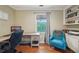 Functional home office space with desk, comfortable chair, and built-in shelving, ideal for remote work at 177 Coopers Pond Dr, Lawrenceville, GA 30044