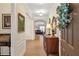 Elegant foyer featuring wood floors and a decorative wreath on the front door at 2920 Farmstead Way, Suwanee, GA 30024