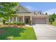 Charming brick home with a well-manicured lawn and a two-car garage at 2920 Farmstead Way, Suwanee, GA 30024