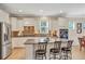 Modern kitchen with stainless steel appliances, granite countertops, and a breakfast bar at 2920 Farmstead Way, Suwanee, GA 30024