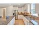 Elegant kitchen featuring granite countertops, stainless steel appliances, and ample cabinet space at 2920 Farmstead Way, Suwanee, GA 30024