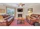 Inviting living room with a fireplace, comfortable seating, and a cozy atmosphere at 2920 Farmstead Way, Suwanee, GA 30024