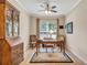 Bright office with a large window, wood floors, and a classic writing desk at 2920 Farmstead Way, Suwanee, GA 30024