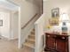 Carpeted stairway with wooden handrail and adjacent decor at 2920 Farmstead Way, Suwanee, GA 30024