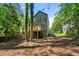 A sprawling backyard and exterior view of this home with a small deck at 5115 Leland Dr, Stone Mountain, GA 30083