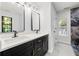 Modern bathroom with double vanity, quartz countertops, and stunning marble accents at 5115 Leland Dr, Stone Mountain, GA 30083