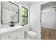 Chic bathroom featuring a modern vanity, toilet, and a glimpse of a stylish shower at 5115 Leland Dr, Stone Mountain, GA 30083