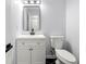 Elegant bathroom with white vanity, stylish mirror, and modern fixtures create a spa-like experience at 5115 Leland Dr, Stone Mountain, GA 30083
