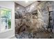Modern bathroom with gray marble tile walls, rainfall shower head, and hexagon tile floor at 5115 Leland Dr, Stone Mountain, GA 30083