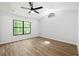Bedroom filled with lots of natural light featuring wood-look floors and a ceiling fan at 5115 Leland Dr, Stone Mountain, GA 30083