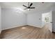 Large bedroom with wood-look floors, vaulted ceilings, and a unique window at 5115 Leland Dr, Stone Mountain, GA 30083
