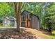 View of the home with its two-story design and contrasting brick and siding, next to neighboring house at 5115 Leland Dr, Stone Mountain, GA 30083