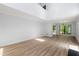 Open concept living area showcasing hardwood floors, natural light and high ceilings at 5115 Leland Dr, Stone Mountain, GA 30083