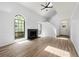 Inviting living room with gas fireplace, hardwood flooring, large windows and high ceilings at 5115 Leland Dr, Stone Mountain, GA 30083