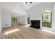 Bright living room features vaulted ceiling, gas fireplace, hardwood floors, and large windows at 5115 Leland Dr, Stone Mountain, GA 30083