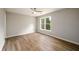 Neutral bedroom featuring modern floors, a ceiling fan and great natural light at 620 Reeves Hill Pt, Lawrenceville, GA 30043