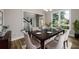 Formal dining room with hardwood floors, elegant chandelier, and seating for six at 620 Reeves Hill Pt, Lawrenceville, GA 30043