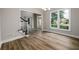 Bright and spacious entry with large window and gleaming hardwood floors and transom window at 620 Reeves Hill Pt, Lawrenceville, GA 30043