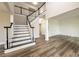 Spacious foyer showcasing beautiful staircase, hardwood floors and open floor plan at 620 Reeves Hill Pt, Lawrenceville, GA 30043