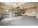 Spacious three-car garage with finished walls, bright lighting, and epoxy flooring offering functionality at 620 Reeves Hill Pt, Lawrenceville, GA 30043