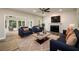 Spacious living area with a fireplace, modern flooring and lots of seating at 620 Reeves Hill Pt, Lawrenceville, GA 30043