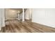 Elegant living space highlighting beautiful floors, trimwork, and an open staircase at 620 Reeves Hill Pt, Lawrenceville, GA 30043