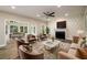 Cozy living room with fireplace, hardwood flooring, and lots of seating at 620 Reeves Hill Pt, Lawrenceville, GA 30043