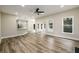 Open floor plan living room featuring wood floors, recessed lights and an open bar to the kitchen at 620 Reeves Hill Pt, Lawrenceville, GA 30043