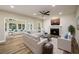 Open-concept living room featuring a fireplace, ceiling fan and neutral decor at 620 Reeves Hill Pt, Lawrenceville, GA 30043
