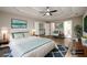 Bright main bedroom featuring a bed, area rug, decor, and ensuite bathroom access at 620 Reeves Hill Pt, Lawrenceville, GA 30043