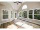 Inviting sunroom boasts lots of natural light, vaulted ceilings, and sliding door to the backyard at 620 Reeves Hill Pt, Lawrenceville, GA 30043