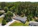 Aerial view of a home showing trees and a large yard with a covered parking structure at 681 Fielding Sw Ln, Atlanta, GA 30311
