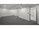 Open basement area with gray carpet, recessed lighting, and doors leading to other rooms at 681 Fielding Sw Ln, Atlanta, GA 30311