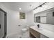 Modern bathroom featuring a glass shower, and a white sink and toilet at 681 Fielding Sw Ln, Atlanta, GA 30311