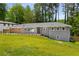 Inviting single-story home with lush green lawn and meticulously maintained landscaping at 681 Fielding Sw Ln, Atlanta, GA 30311