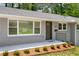 Close-up of well kept home featuring manicured landscaping and a welcoming entryway at 681 Fielding Sw Ln, Atlanta, GA 30311