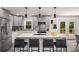 Modern kitchen with a center island, marble countertops, and stainless steel appliances at 681 Fielding Sw Ln, Atlanta, GA 30311