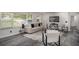 Comfortable living room featuring a plush sofa, accent chairs, and stylish decor at 681 Fielding Sw Ln, Atlanta, GA 30311