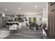 Open-concept kitchen and dining area featuring modern gray tones and beautiful stone floors at 681 Fielding Sw Ln, Atlanta, GA 30311
