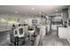 Bright open floorplan with modern finishes showcases the seamless flow between the dining, living, and kitchen areas at 681 Fielding Sw Ln, Atlanta, GA 30311