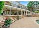 Stunning backyard with large patio and stone stair access to the upper deck at 7025 Kettering Ln, Suwanee, GA 30024