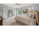 Inviting bedroom with a comfortable bed, ample natural light, and an en-suite bathroom for added convenience at 7025 Kettering Ln, Suwanee, GA 30024