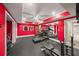Home gym with rubber flooring, full mirror, treadmill, and weight lifting equipment at 7025 Kettering Ln, Suwanee, GA 30024