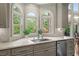 Close up of kitchen with granite countertops and stainless steel dishwasher at 7025 Kettering Ln, Suwanee, GA 30024