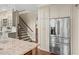 Close up of kitchen stainless steel refrigerator and lots of cabinets at 7025 Kettering Ln, Suwanee, GA 30024