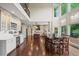 Open-concept kitchen with white cabinets, stainless steel appliances, and a large island perfect for entertaining at 7025 Kettering Ln, Suwanee, GA 30024