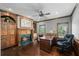 Traditional office space with wood accents, a fireplace, and a large desk area perfect for working from home at 7025 Kettering Ln, Suwanee, GA 30024